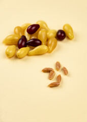 Yellow and red Cornelian cherry dogwood or cornus mas beries. Healthy low carb berry. Pulpy, sweet and sour fruit.