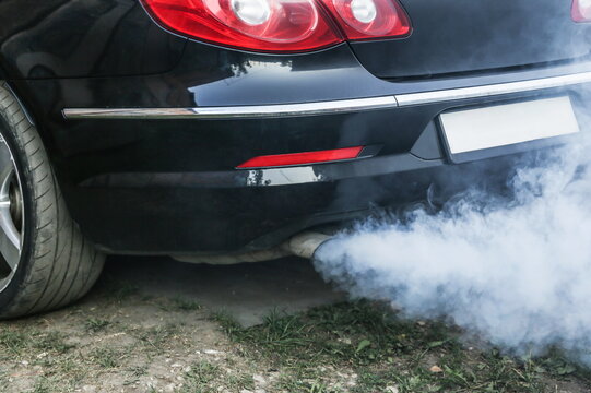 smoke from the exhaust pipe of a car. harm to the environment from internal combustion engines. the engine consumes oil. increased oil consumption in the engine