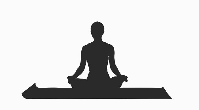 Silhouette of woman practicing yoga on mat 