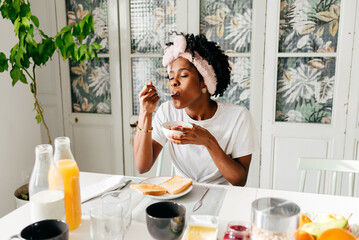 African American woman having breakfast at home