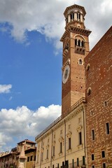 Fototapeta na wymiar historic tower building, italian historic architecture, Verona architecture, old tower, blue sky with white clouds