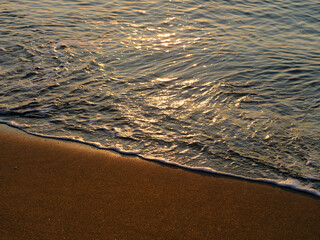 sea waves on the beach at sunset