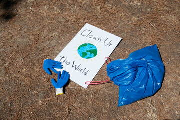 sign on the ground that says Clean Up The World