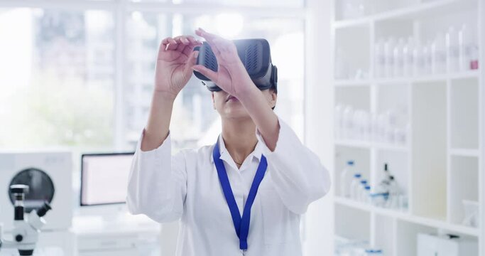 Science, metaverse and virtual reality or vr digital headset on researcher in a laboratory working on a futuristic, future and ux. Woman busy on ai 3d software data and cyber information technology
