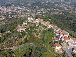 Fototapeta premium Little village in Tuscany, Italy called Metato in the mountains with green forrest