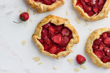 Mini-biscuits made of strawberries on a white background. Delicious mini-pies. Top view