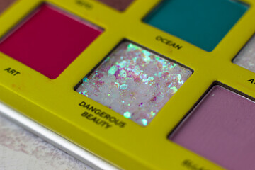 Eye shadow close-up. Professional bright pigments for makeup. Makeup Artist Cosmetics