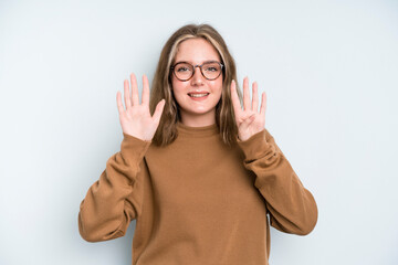 caucasian pretty woman smiling and looking friendly, showing number nine or ninth with hand...