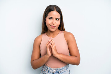 hispanic latin pretty woman feeling proud, mischievous and arrogant while scheming an evil plan or...