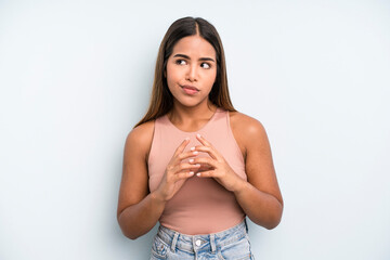 hispanic latin pretty woman scheming and conspiring, thinking devious tricks and cheats, cunning...