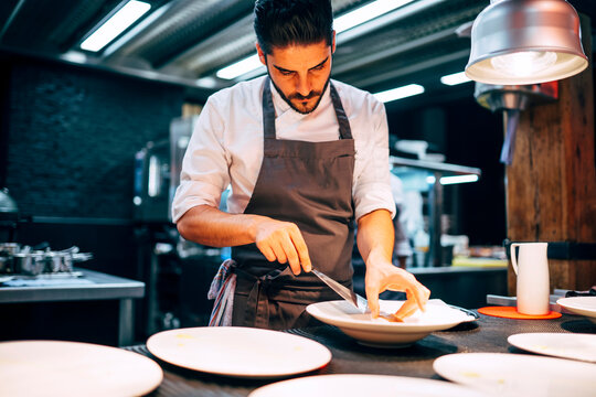 Man at counter serving dishes