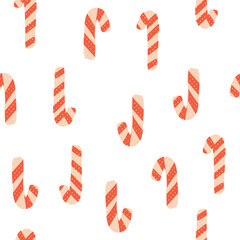 Christmas candy canes seamless pattern on isolated background. Vector retro repeat with traditional Christmas sweets.