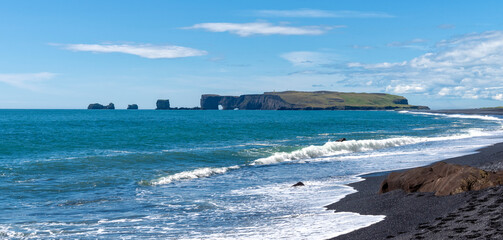 The peninsula Dyrh&oacute;laey near the black sand beach Reynisfjara, Iceland