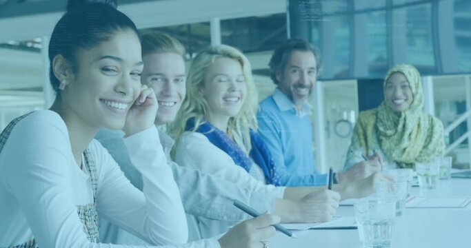Animation of data processing over portrait of diverse male and female colleagues smiling at office