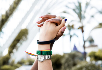 Clasped hands of lesbian couple