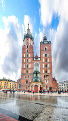 Fototapeta na wymiar Astonishing cityscape of Krakow with St. Mary's Basilica on Main Square.