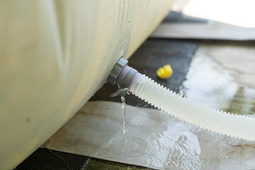 Blue plastic hose for cleaning a swimming pool, Close-up