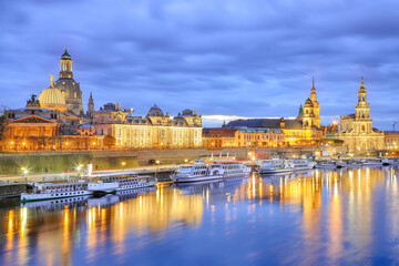 Sunset on Elbe river with panorama of Cathedral of the Holy Trinity or Hofkirche, Bruehl's Terrace...