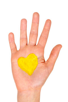 Hand with painted yellow heart symbol