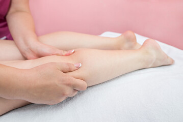 Fototapeta na wymiar Anti-cellulite foot massage in spa salon.