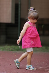 Fototapeta premium portrait of a little child in a pink dress in sofia bulgaria 