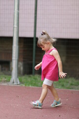 portrait of a little child in a pink dress in sofia bulgaria 