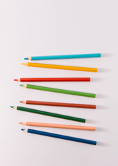 Colored wooden pencils on gray background, minimal back to school concept