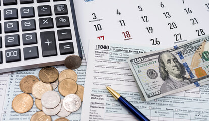 top view of a table with a calendar with the date of filing a citizen's income declaration.