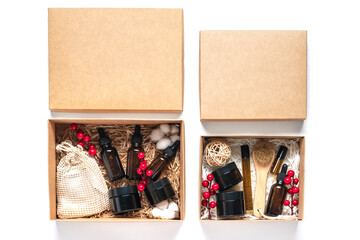 Set for care box Eco-friendly cosmetics Oil and cream bottles, brush for washing, cotton pads on white background Gift for girlfriend, mother to celebrate Christmas concept Top view Flat lay