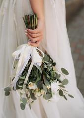 wedding bouquet in hands of the bride