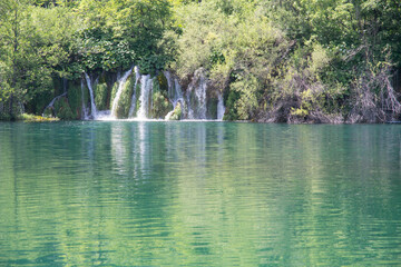 Beautiful paradise. Blue lake and cascade in the forest, Plitvice lakes, Croatia.