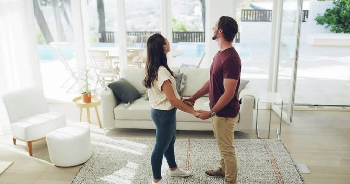 Couple with real estate, moving house and new home of property, building and apartment for sale and rent. Happy, smile and hug man and woman in love excited to be living in dream interior together