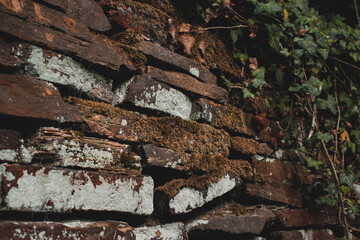 Stack pile of old natural rocks stone wall barrier background