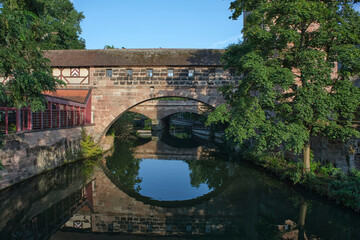 Fototapeta premium Henkerbrucke Romantic medieval bridge in Nuremberg . Old Town and Pegnitz river in Nuremberg Bavaria Germany