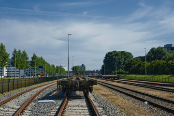 Fototapeta na wymiar Rotterdam, The Netherlands. Low angle view of long line of freight trains on tracks in the port of rotterdam
