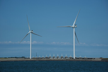 View of Neeltje Jans flood barrier with wind turbines