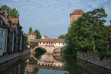 Fototapeta na wymiar Henkerbrucke Romantic medieval bridge in Nuremberg . Old Town and Pegnitz river in Nuremberg Bavaria Germany
