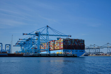 ROTTERDAM, THE NETHERLANDS - New container terminal with a very large container ship and in the...