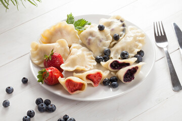 Dumplings with strawberries and blueberries