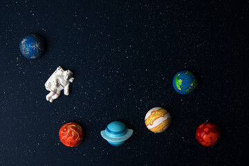 astronaut and planets on space background