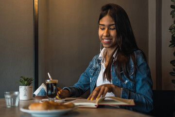 Student doing homework in cafe