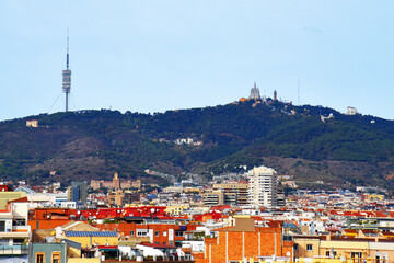 Obraz premium Barcelona Spain, high angle view city skyline. Mountains skyline in Spain rooftop view in Barcelona. Facade of the old building and residential buildings at hills and mountains. Historic building.