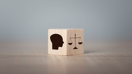 Ethics inside human mind, Business ethics concept. Hand flip ethics inside a head symbols in wooden...