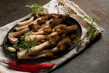 Morel mushrooms on a metal plate
