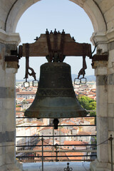 Naklejka premium 2022.07.15 Italy, Pisa, leaning tower of Pisa evocative image of one of the bells of the tower placed on top of it