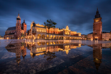 The main square in Krakow with a view of the cloth hall, St. Mary's Basilica in a natural mirror....