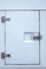 Closed white refrigerated truck door