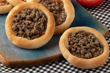 Focus on traditional Arabian food meat sfiha.