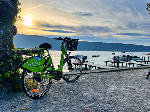 electric bike rental on edge sunset lake annecy -Menthon st Bernard, France - October 02 2021