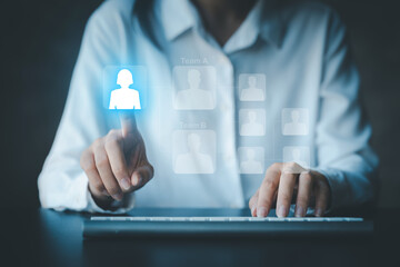 Business woman pointing to company recruitment icon hologram, analysis and development solution,...
